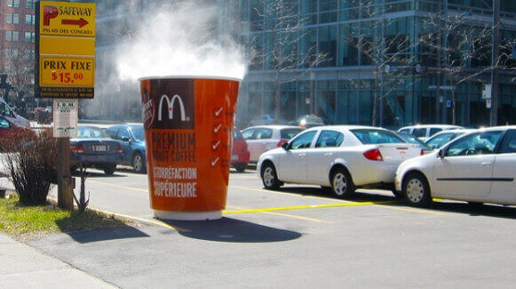 McDonalds guerrilla marketing strategy: this steaming cup of coffee. It's a 3D prop covering a manhole. Well played, McDonald's. 